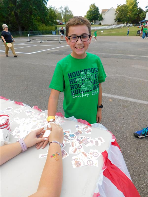 Students outside enjoying a family fun night for their school.